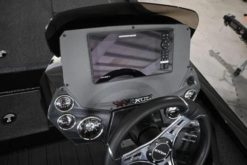 Slide: The Image of 2026 Vexus AVX 1980 boat dashboard with advanced navigation system and steering wheel. - 9