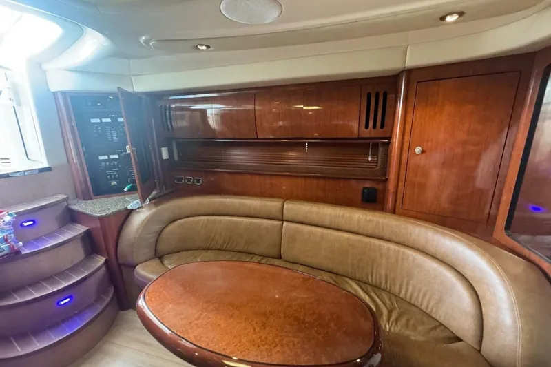 Slide: The Image of Luxurious interior of 2005 Sea Ray 420 Sundancer yacht with leather seating and wooden cabinetry. - 16