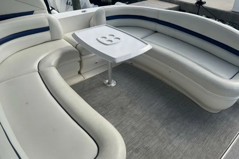 Slide: The Image of Luxurious seating area on 2005 Sea Ray 420 Sundancer yacht with table. - 5