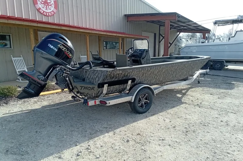 Slide: The Image of 2026 Thor 1900 Low Country Elite boat with Yamaha engine on trailer. - 13