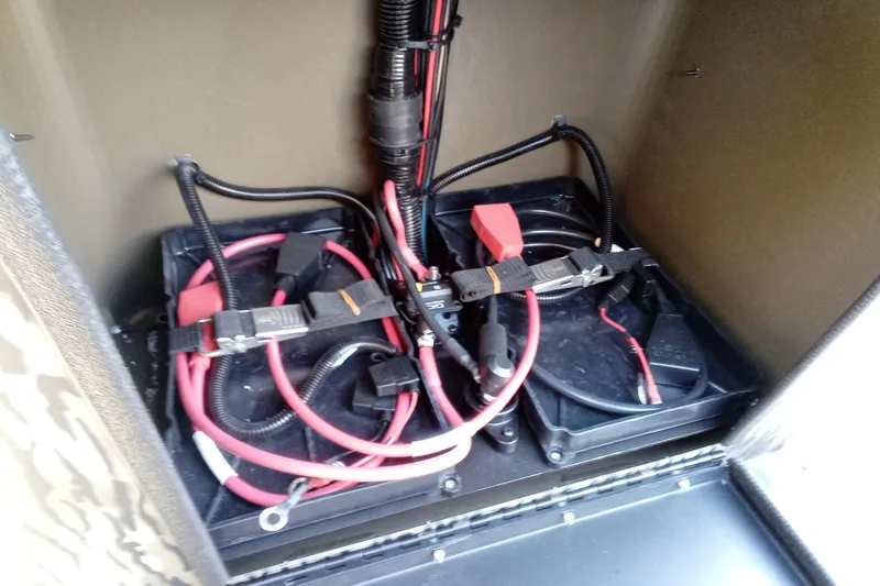 Slide: The Image of Battery compartment of 2026 Thor 1900 Low Country Elite with cables and connectors. - 18