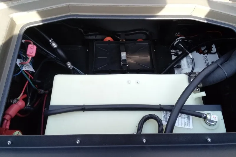 Slide: The Image of Engine compartment of 2026 Thor 1900 Low Country Elite with visible wiring and components. - 19