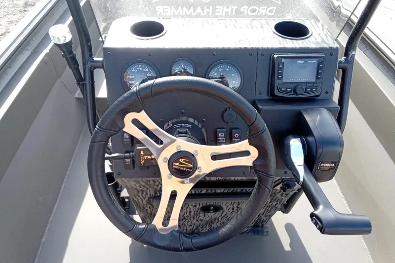 Slide: The Image of Steering console of 2026 Thor 1900 Low Country Elite boat with gauges and controls. - 22