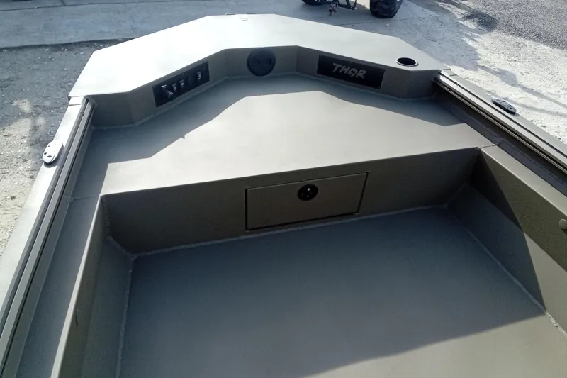 Slide: The Image of 2026 Thor 1900 Low Country Elite boat interior with control panel and storage compartment. - 23