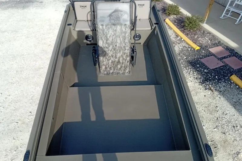 Slide: The Image of 2026 Thor 1900 Low Country Elite boat interior, featuring spacious seating and modern design. - 24