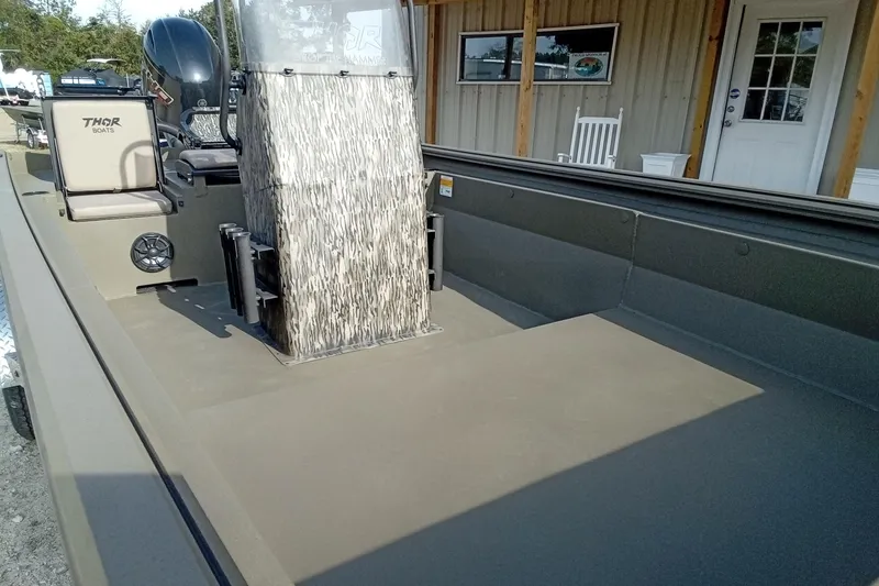 Slide: The Image of 2026 Thor 1900 Low Country Elite boat with camouflage console and seating. - 9