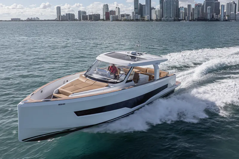 The Image of 2024 Fjord Boats 53XL cruising near city skyline on a sunny day. - 1