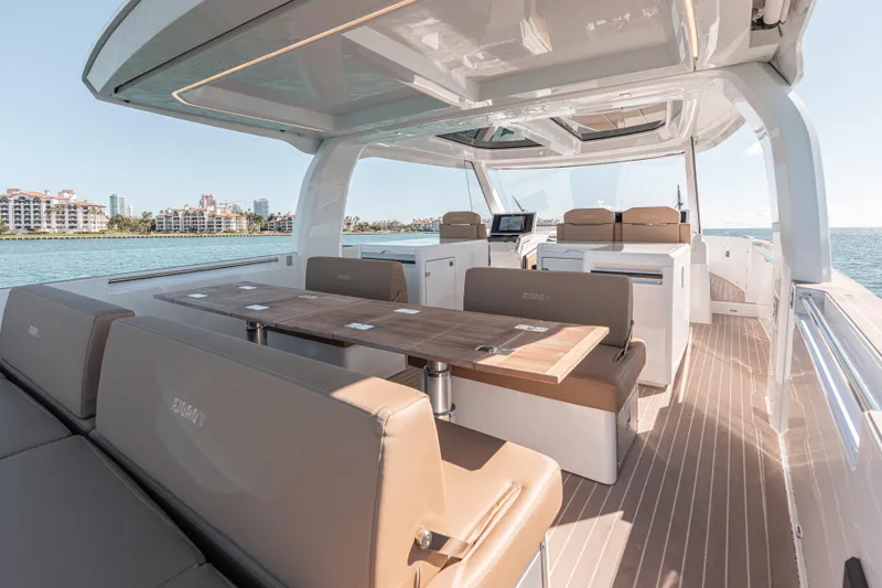 Slide: The Image of Luxurious 2024 Fjord Boats 53XL interior with elegant seating and ocean view. - 13