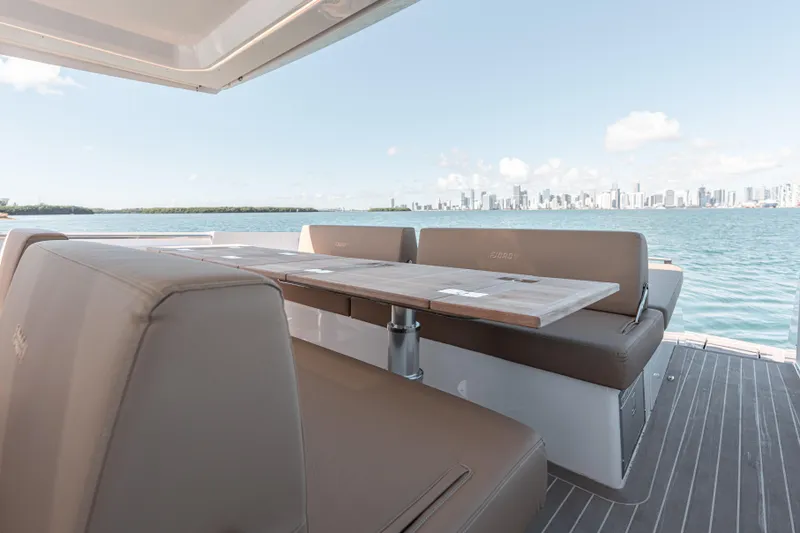 Slide: The Image of Luxurious seating area on 2024 Fjord Boats 53XL with ocean and city skyline view. - 14