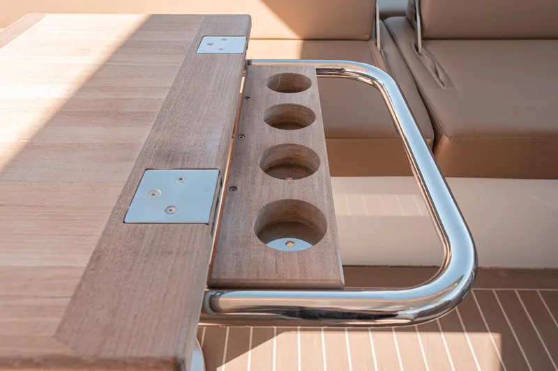 Slide: The Image of Luxury wooden table with cup holders on 2024 Fjord Boats 53XL. - 15