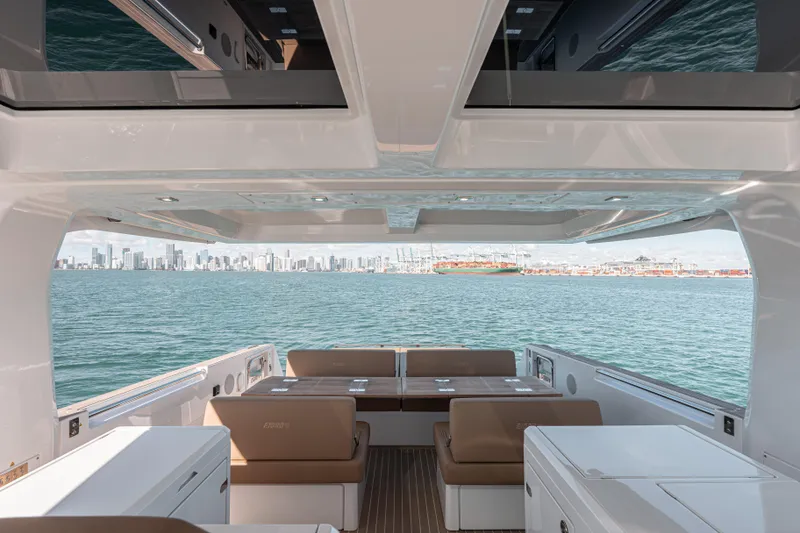 Slide: The Image of 2024 Fjord Boats 53XL interior with city skyline view, featuring sleek design and spacious seating. - 17