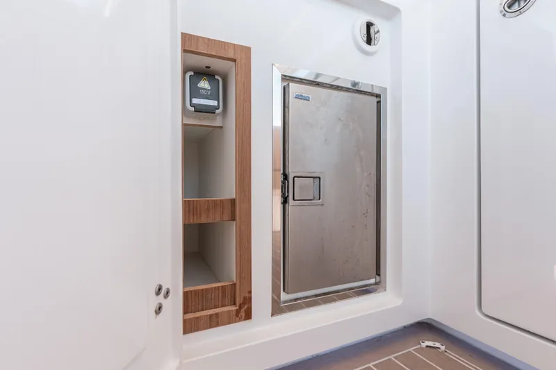 Slide: The Image of Interior of 2024 Fjord Boats 53XL featuring storage and electrical panel. - 20