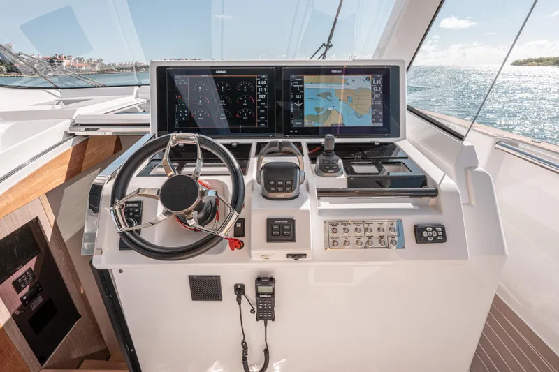 Slide: The Image of 2024 Fjord Boats 53XL helm with advanced navigation displays and controls. - 24