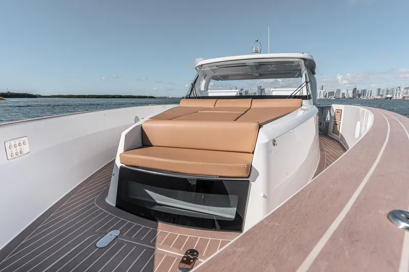 Slide: The Image of 2024 Fjord Boats 53XL luxury yacht with spacious deck and sleek design on open water. - 31