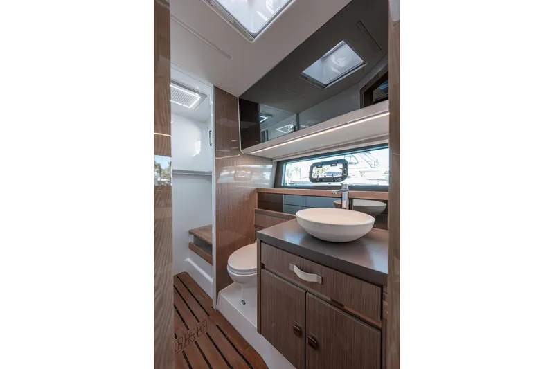 Slide: The Image of Luxurious bathroom interior of 2024 Fjord Boats 53XL with modern fixtures and wood accents. - 36