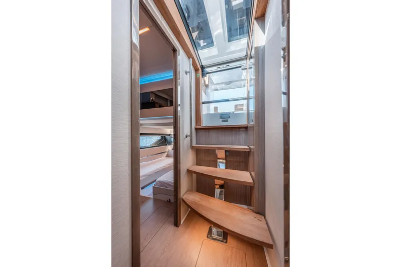 Slide: The Image of Interior of 2024 Fjord Boats 53XL, featuring wooden stairs and modern design. - 38