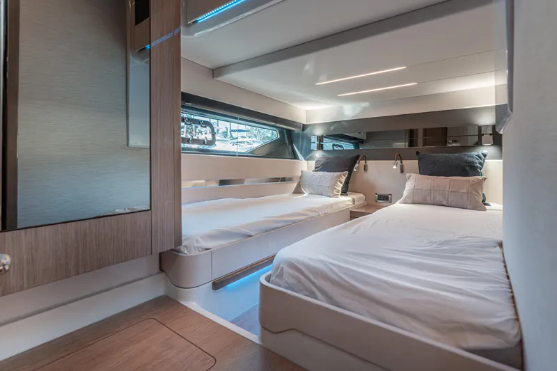 Slide: The Image of Luxurious 2024 Fjord Boats 53XL cabin interior with modern twin beds and elegant lighting. - 39
