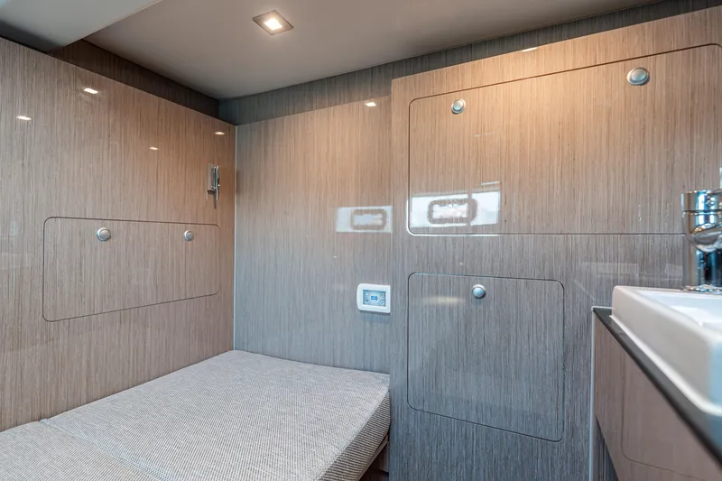 Slide: The Image of 2024 Fjord Boats 53XL interior cabin with modern wood paneling and sleek design. - 43