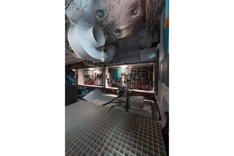 Slide: The Image of Engine room of 2024 Fjord Boats 53XL, showcasing advanced mechanical systems and wiring. - 49