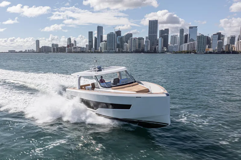 Slide: The Image of 2024 Fjord Boats 53XL cruising near city skyline on a sunny day. - 7