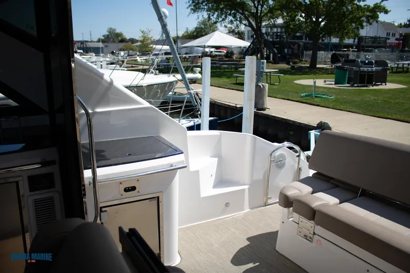 Slide: The Image of 2016 Regal 42 Sport Coupe yacht interior with dockside view. - 19