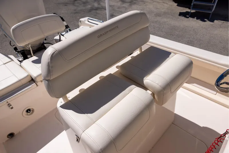 Slide: The Image of 2021 Grady-White 251 Coastal Explorer boat seating, featuring luxurious white upholstery. - 12