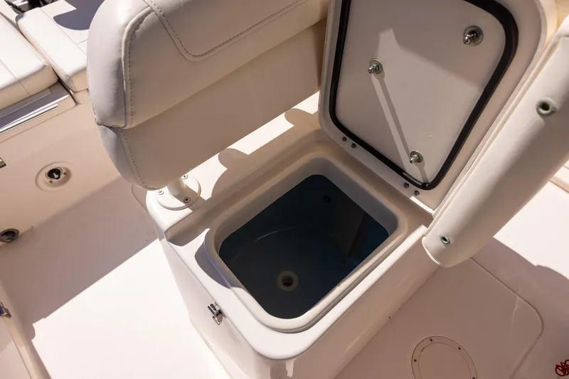 Slide: The Image of 2021 Grady-White 251 Coastal Explorer boat seat with open storage compartment. - 13