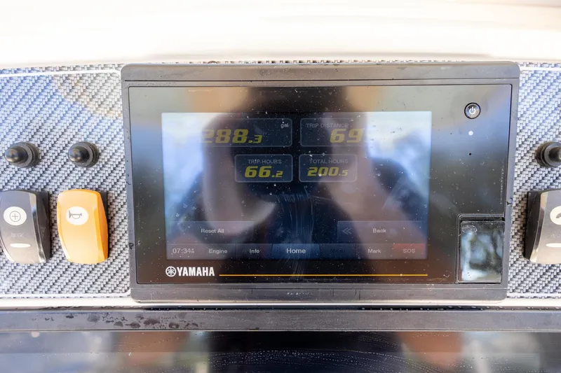 Slide: The Image of Yamaha display on 2021 Grady-White 251 Coastal Explorer showing trip data and controls. - 14