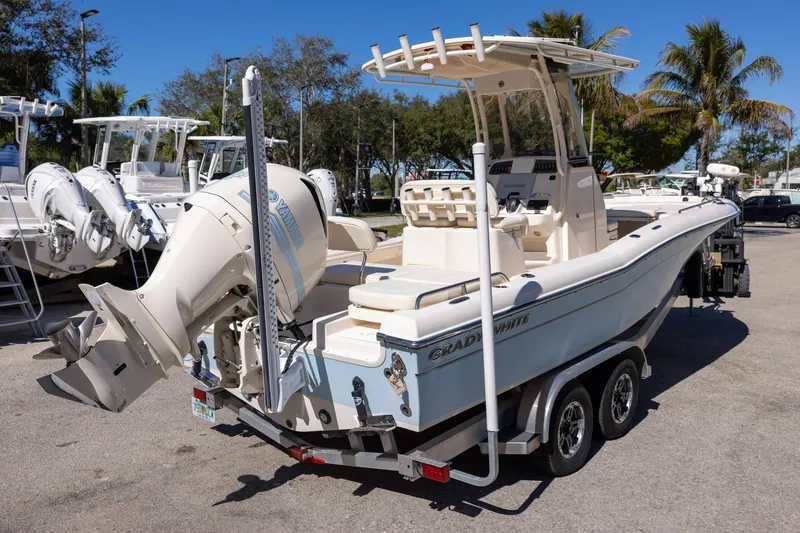 Slide: The Image of 2021 Grady-White 251 Coastal Explorer boat on trailer, parked outdoors. - 4