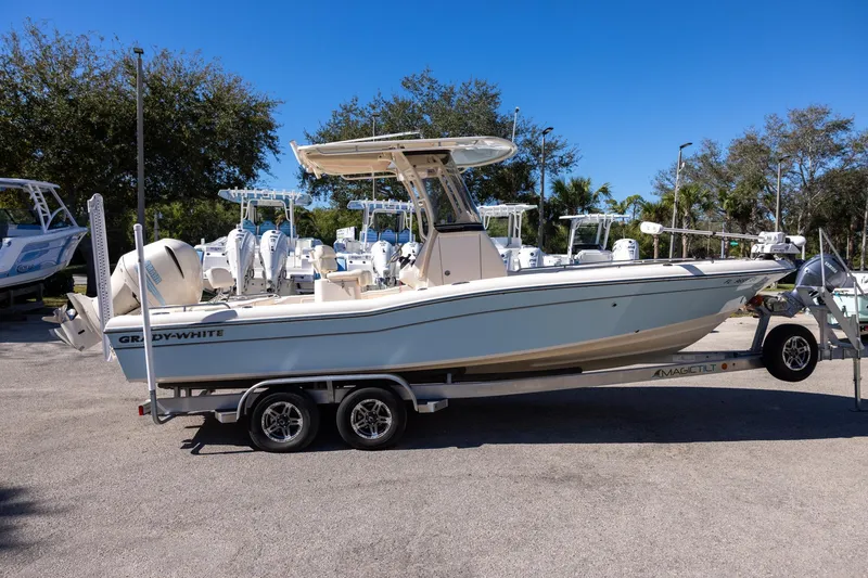 Slide: The Image of 2021 Grady-White 251 Coastal Explorer boat on trailer, parked outdoors. - 5