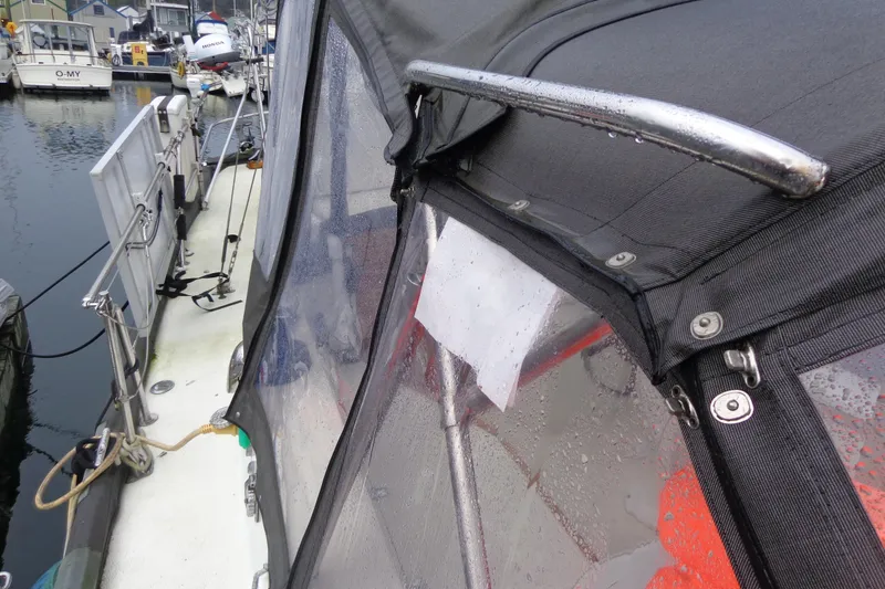 Slide: The Image of 1979 Islander Freeport Center Cockpit Ketch with wet canopy in marina setting. - 11