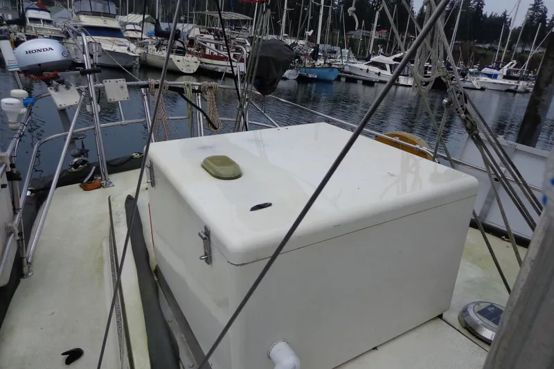 Slide: The Image of 1979 Islander Freeport Center Cockpit Ketch docked, showcasing deck and rigging details. - 12