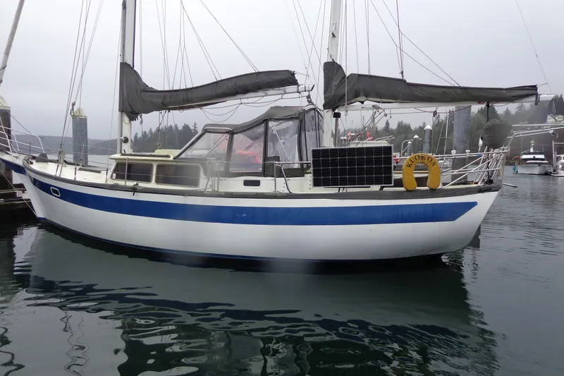 Slide: The Image of 1979 Islander Freeport Center Cockpit Ketch sailboat docked in a marina. - 20