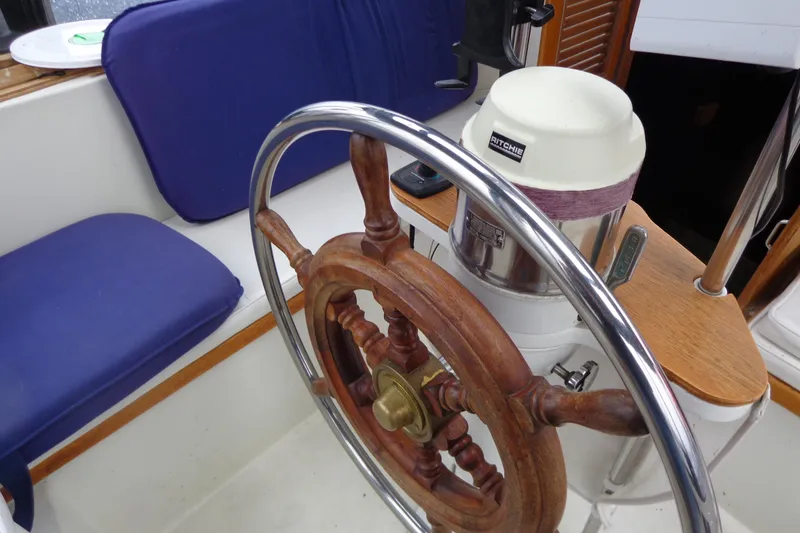 Slide: The Image of Wooden steering wheel of 1979 Islander Freeport Center Cockpit Ketch sailboat. - 27