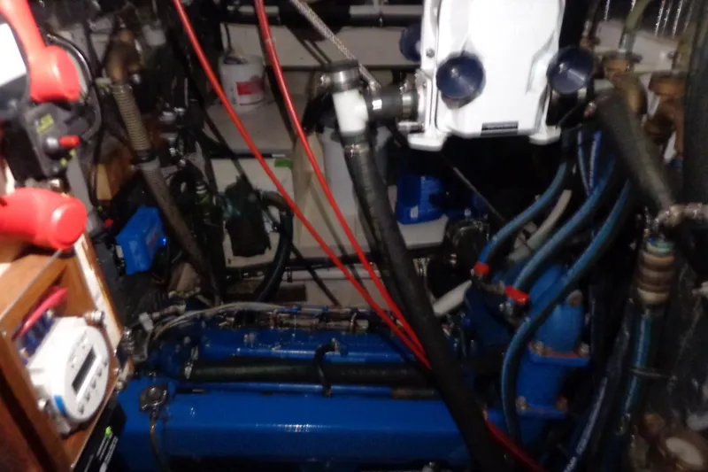 Slide: The Image of Engine room of 1979 Islander Freeport Center Cockpit Ketch with visible machinery and wiring. - 30