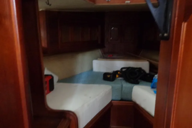 Slide: The Image of Interior cabin of 1979 Islander Freeport Center Cockpit Ketch with wooden finish and cushions. - 40