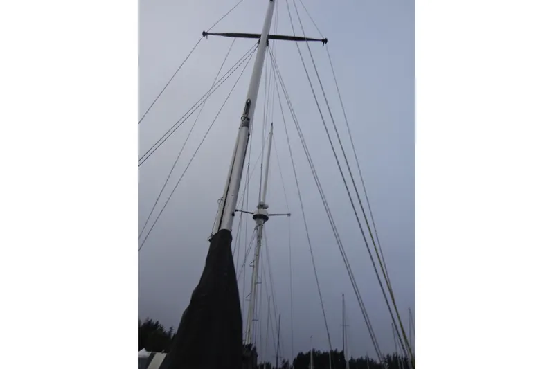 Slide: The Image of Mast and rigging of 1979 Islander Freeport Center Cockpit Ketch sailboat against cloudy sky. - 6