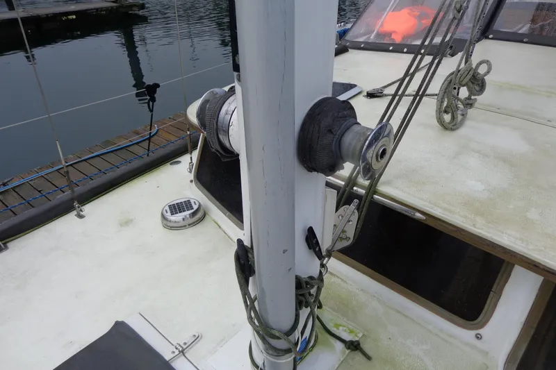 Slide: The Image of 1979 Islander Freeport Center Cockpit Ketch deck with winch and rigging details. - 8