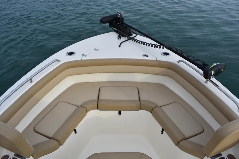 Slide: The Image of 2020 Scout 215 XSF boat interior with tan seating and water view. - 10