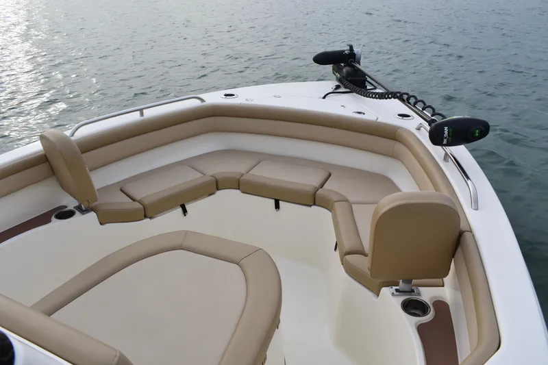 Slide: The Image of 2020 Scout 215 XSF boat interior with tan seating on open water. - 11