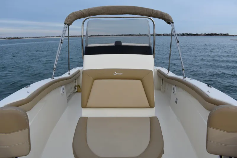 Slide: The Image of 2020 Scout 215 XSF boat interior with fish box cooler storage open. - 12