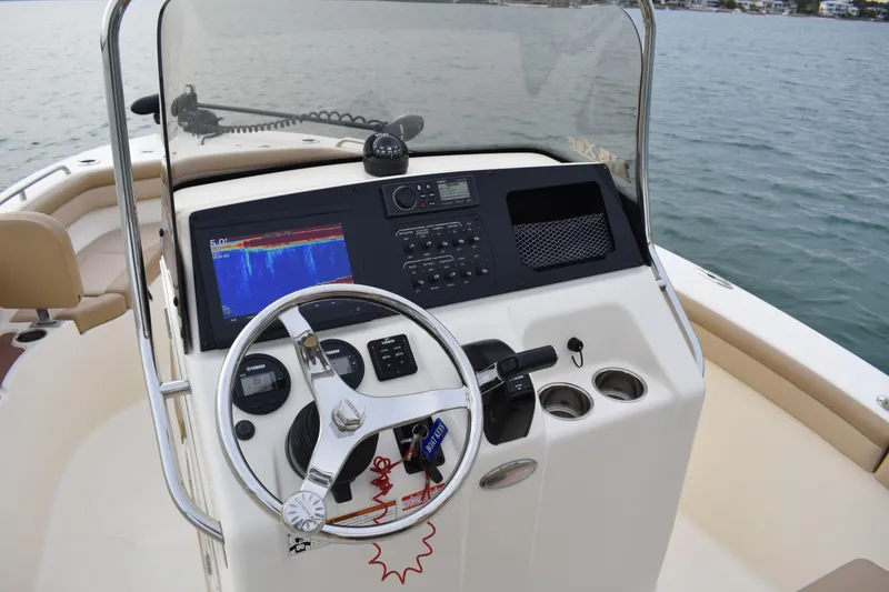 Slide: The Image of 2020 Scout 215 XSF boat dashboard with Garmin display and Yamaha controls. - 14