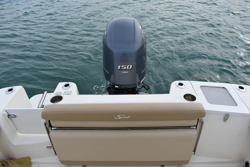 Slide: The Image of 2020 Scout 215 XSF boat dashboard with steering wheel and navigation system. - 20