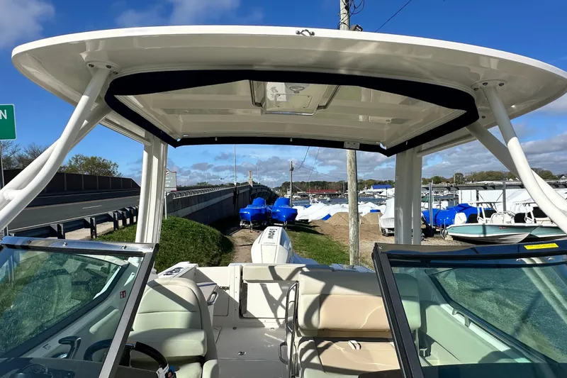 Slide: The Image of Boston Whaler 240 Vantage 2026 with open cockpit and blue sky. - 11