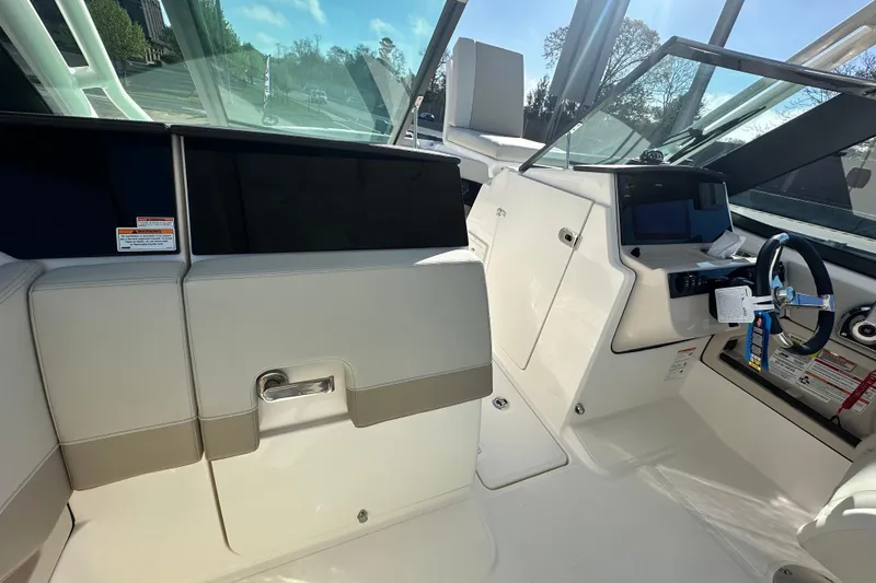 Slide: The Image of Interior of 2026 Boston Whaler 240 Vantage with helm console. - 17