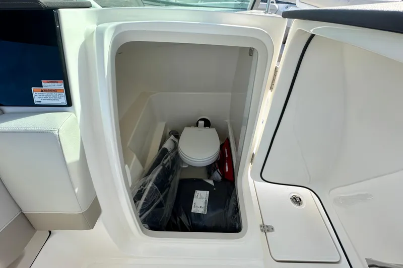 Slide: The Image of Interior of 2026 Boston Whaler 240 Vantage with toilet. - 18