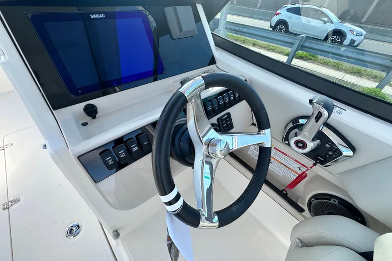 Slide: The Image of Interior view of 2026 Boston Whaler 240 Vantage helm. - 19