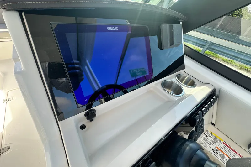 Slide: The Image of Dashboard of 2026 Boston Whaler 240 Vantage with Simrad display. - 20
