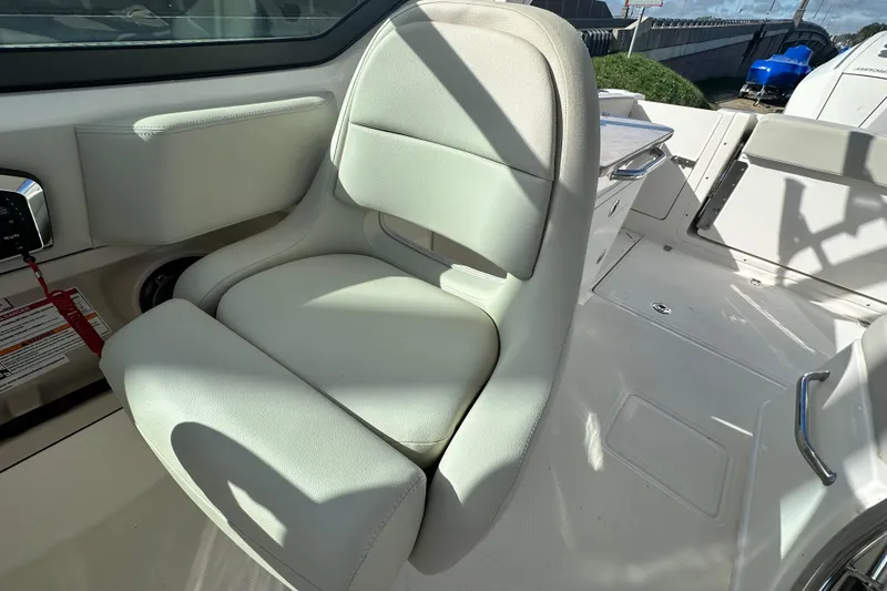 Slide: The Image of Interior of 2026 Boston Whaler 240 Vantage with beige seat. - 23
