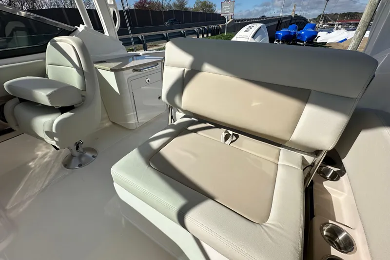 Slide: The Image of Interior of 2026 Boston Whaler 240 Vantage with beige seating. - 24